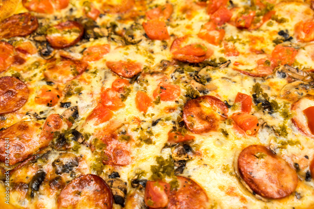 Appetizing background pepperoni pizza closeup filling the frame. Appetizing background pepperoni pizza closeup filling the frame.
