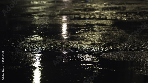CU TU MS Puddles and traffic on street at night, New York City, New York, USA