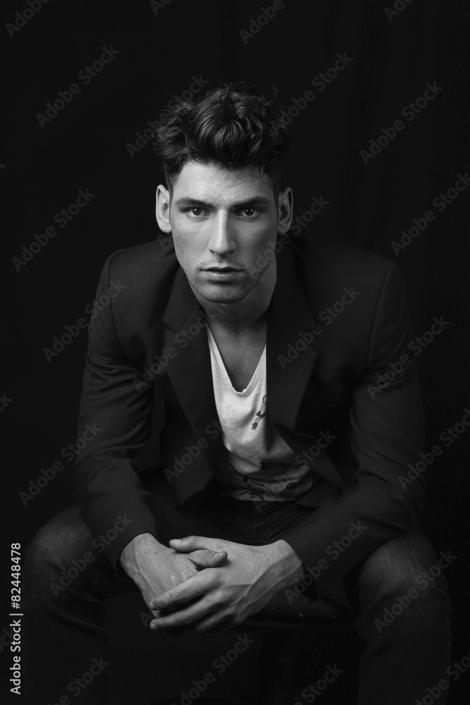 Man sitting in black and white Man sitting in black and white