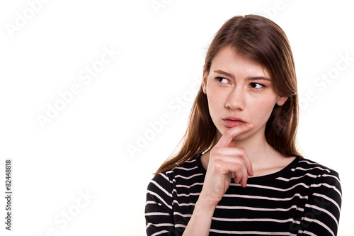 Young woman thinking hand on chin isolated Stock Image