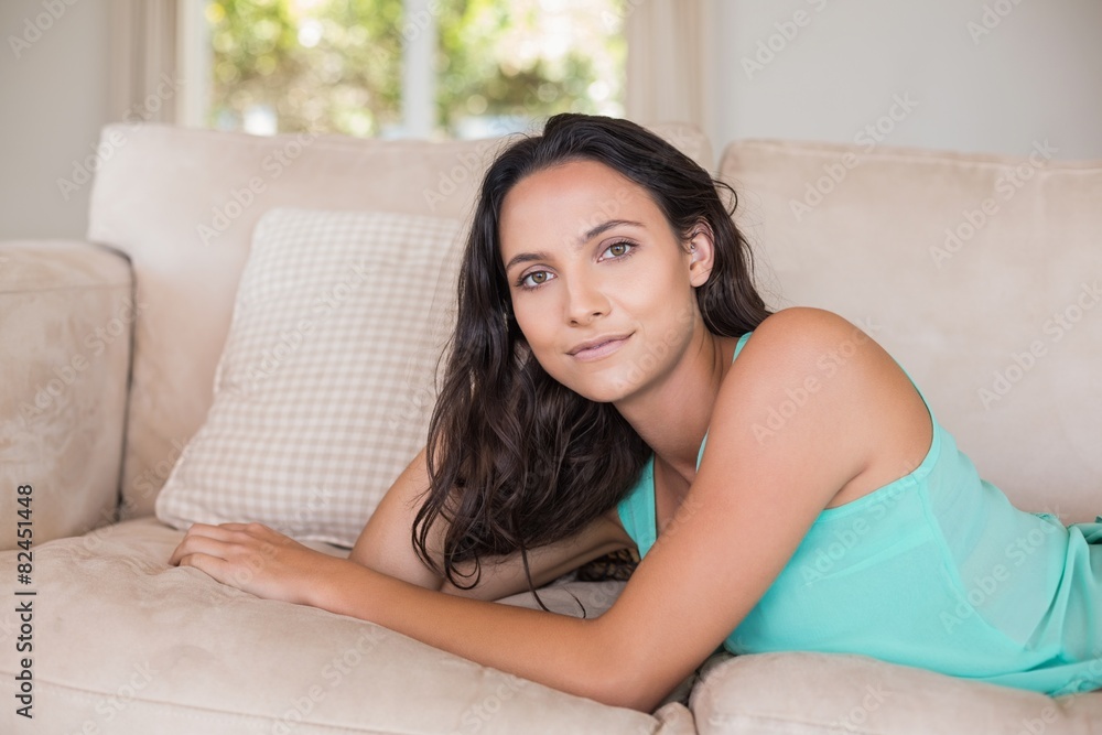 Pretty brunette relaxing on the couch Pretty brunette relaxing on the couch