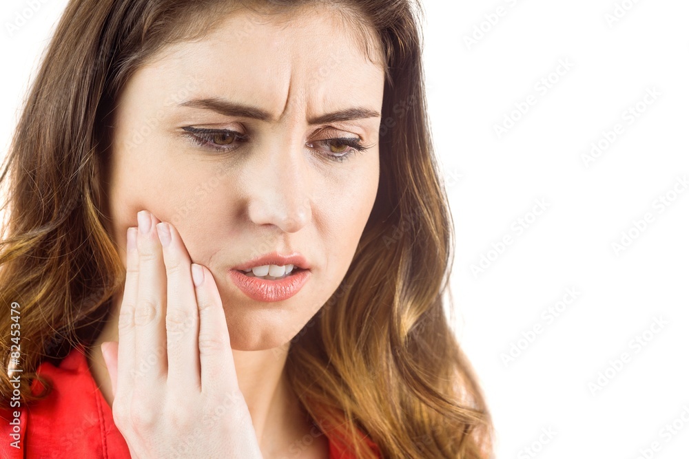 Pretty brunette with a toothache