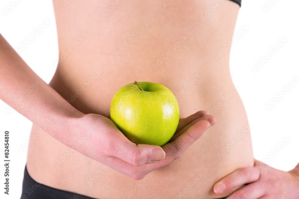 Woman holding green apple Woman holding green apple