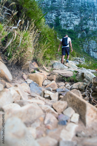 Hiker climbing Table Mountain via Platteklip Gorge. Table Moun