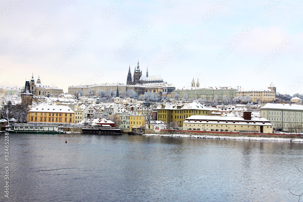 Snowy Prague gothic Castle above River Vltava