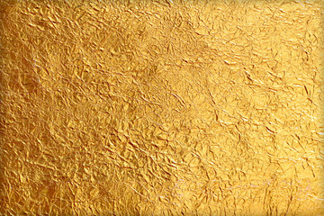 Shiny yellow leaf gold foil texture background