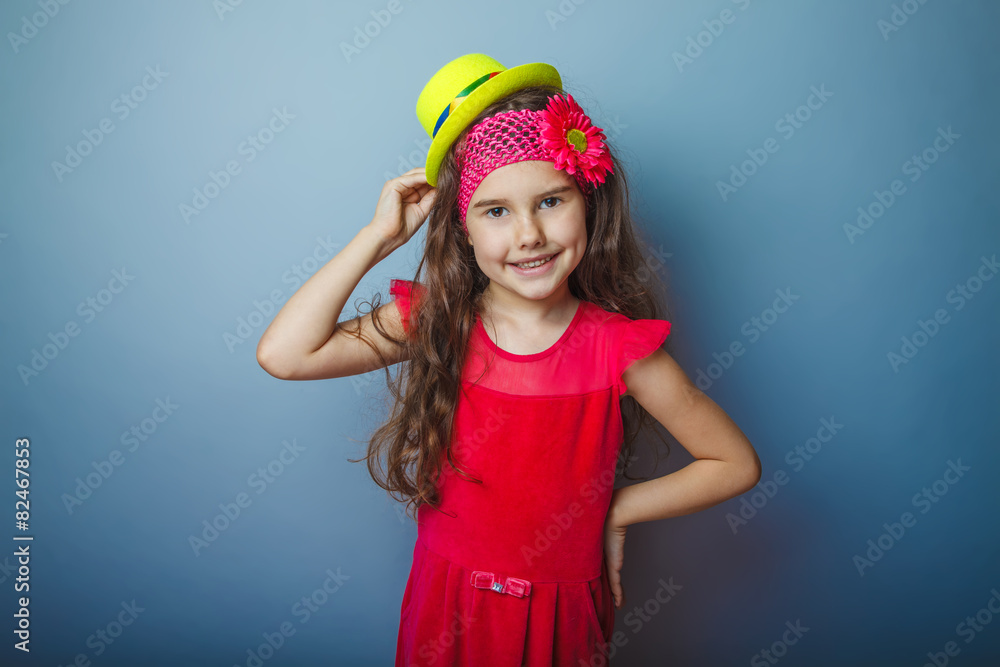 Naklejka premium Girl European appearance haired child of seven years in a bright