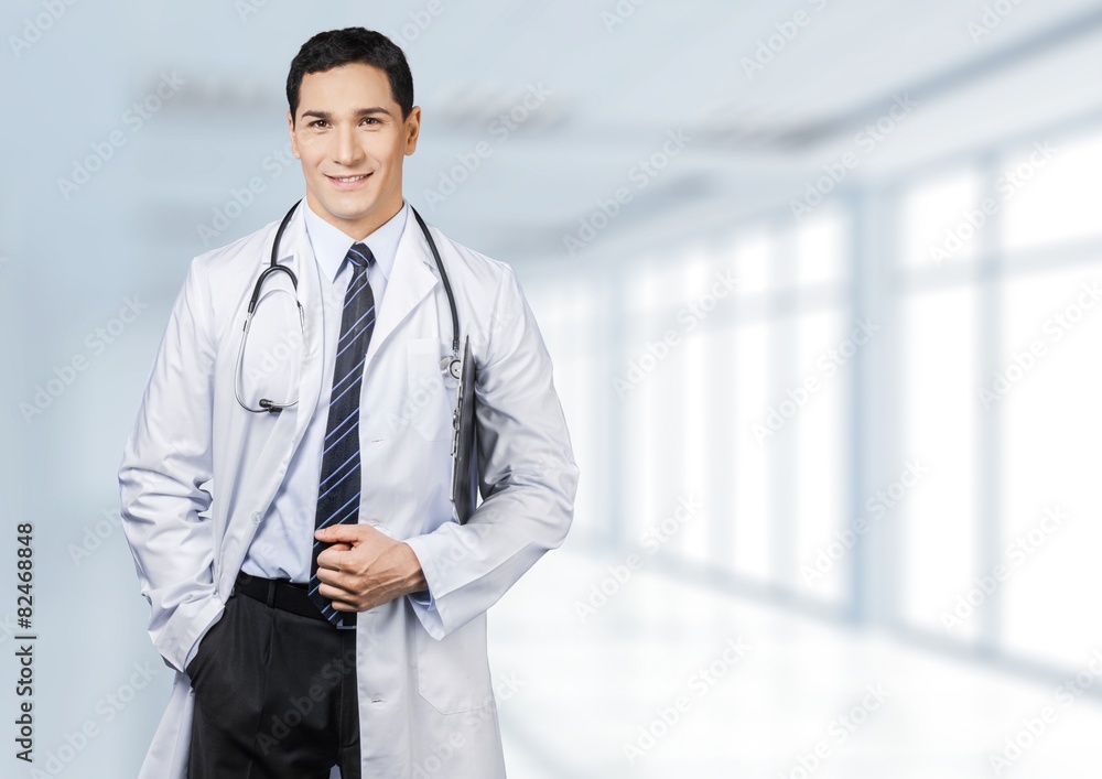 Adult. Portrait of confident young medical doctor on white