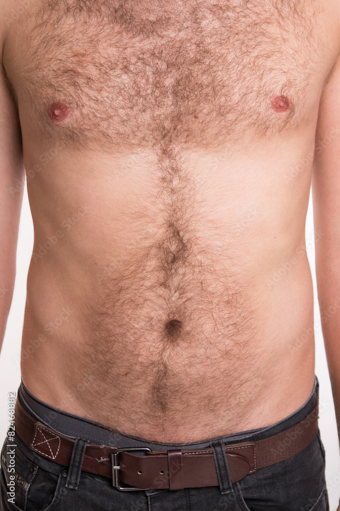 The man with hair on the chest and abdomen Stock Photo | Adobe Stock