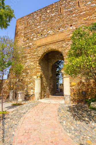 Fototapeta Naklejka Na Ścianę i Meble -  Ancient brick passageway door in the famous La Alcazaba in Malag
