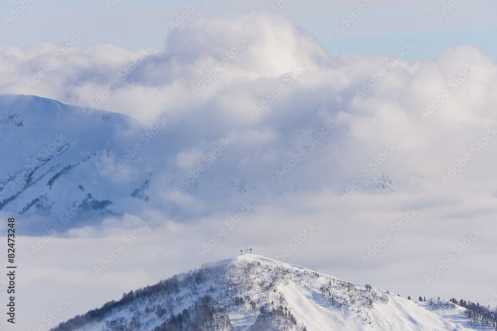 View on mountains and blue sky above clouds View on mountains and blue sky above clouds