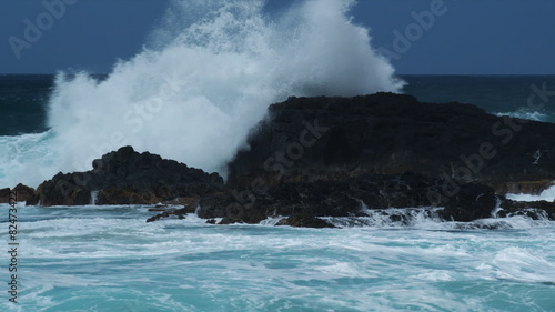 waves crashing over rocks