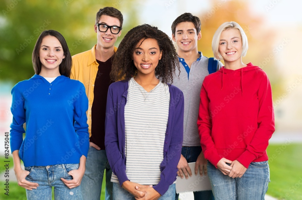 Studying. Education concept - group of students at school Studying. Education concept - group of students at school