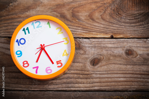 Wallpaper Mural modern alarm clock with colorful number on wooden background Torontodigital.ca