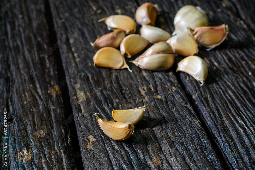 Organic garlic on old wooden