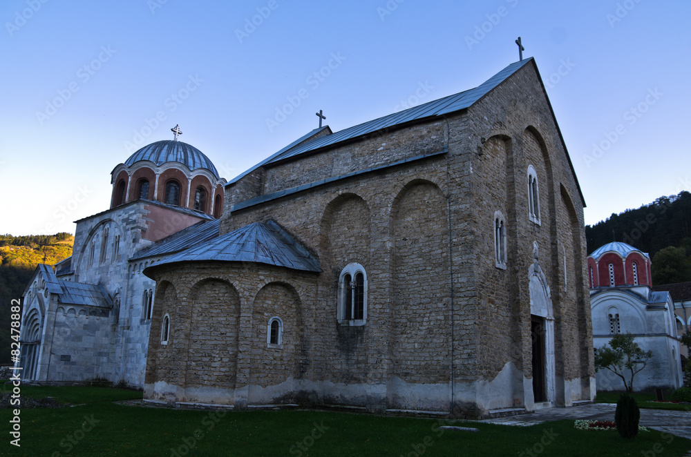 Two churches inside Studenica monastery at sunset