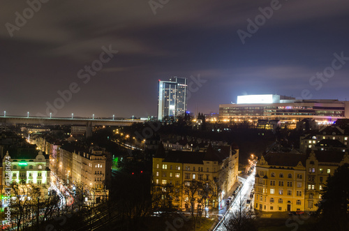 nuselsky bridge and congress center in prague during night photo