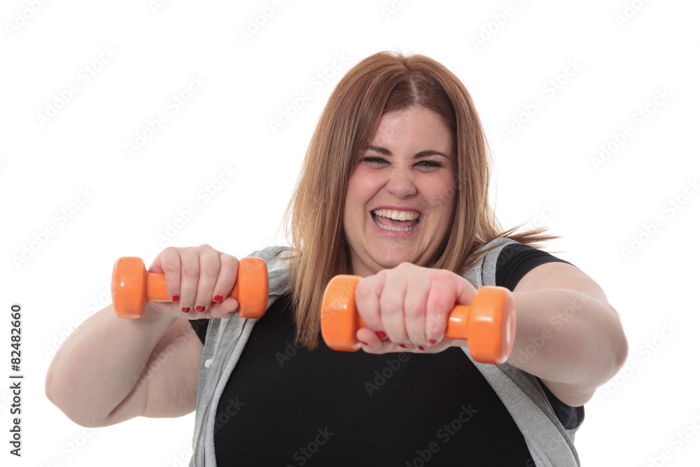 Overweight woman exercising with dumbbells Overweight woman exercising with dumbbells