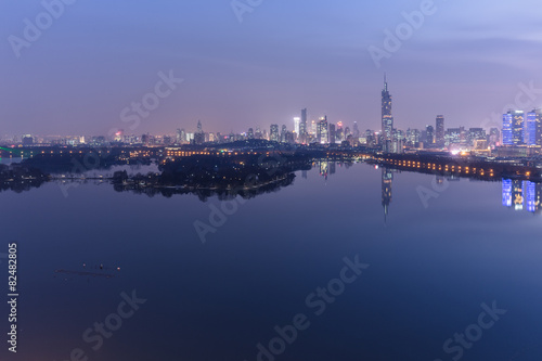 modern nanjing city skyline with the beautiful lake at night