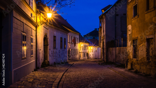 Photography walking through old european town at night
