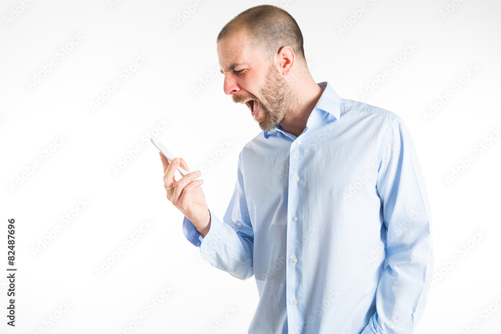 angry man screams at mobile phone angry man screams at mobile phone