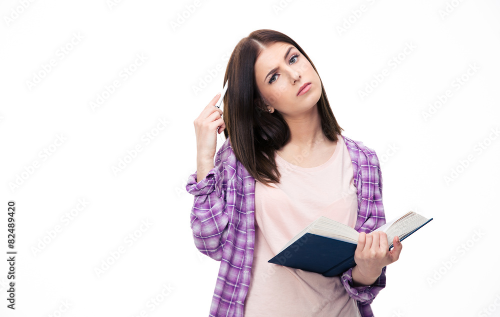 Pensive young female student standing with book Pensive young female student standing with book