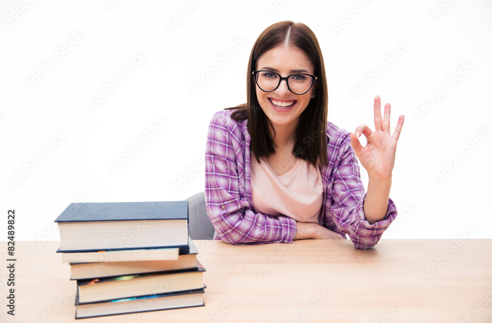 Smiling young female student showing ok sign Smiling young female student showing ok sign