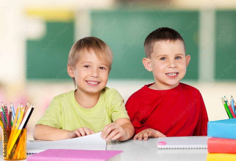 School. Portrait of two diligent girls looking at camera at School. Portrait of two diligent girls looking at camera at