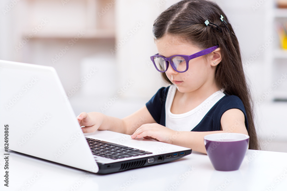 Little dark-haired girl playing role of business woman Little dark-haired girl playing role of business woman