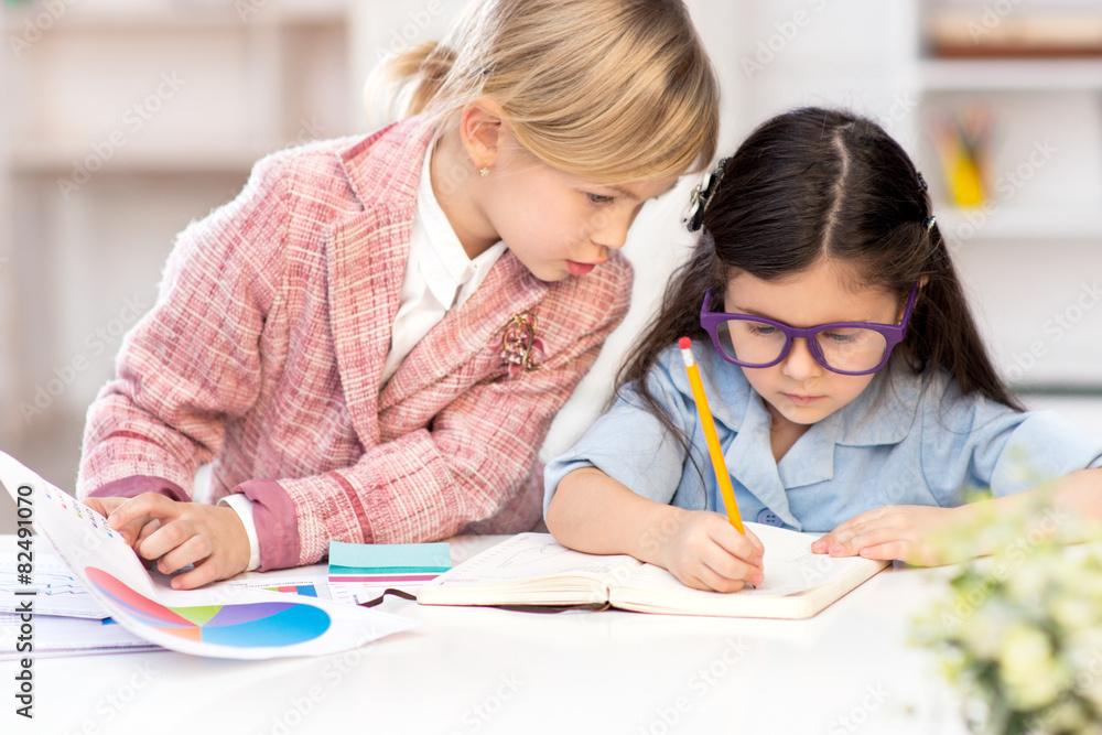 Two little cute girls playing role of business women Two little cute girls playing role of business women