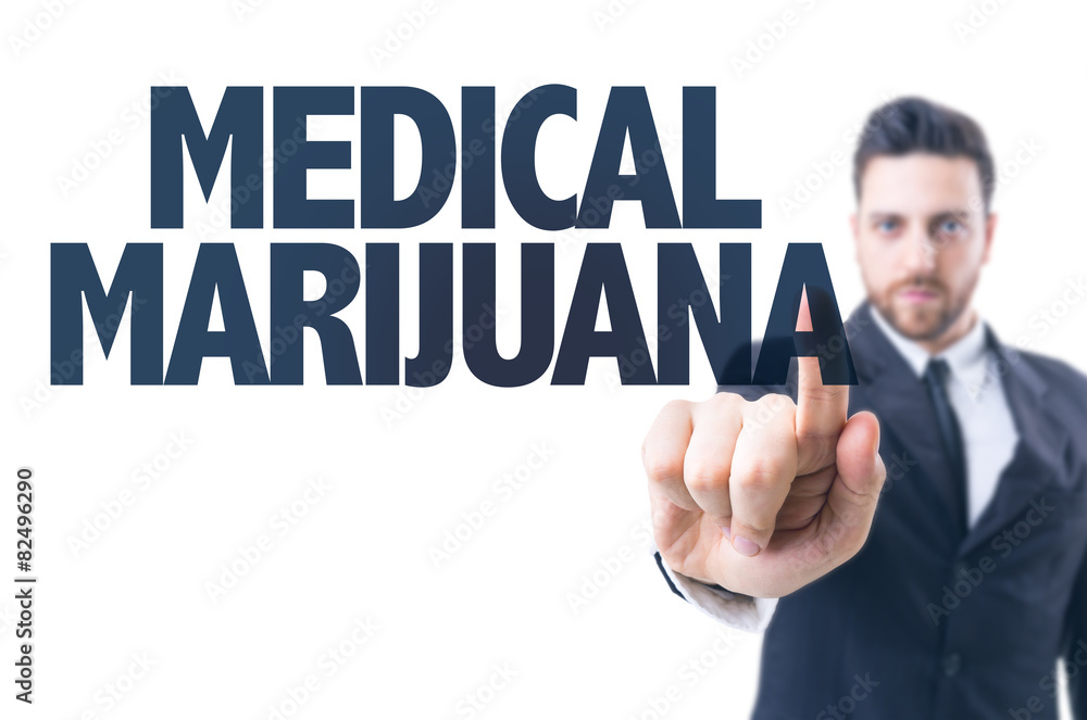 Business man pointing the text: Medical Marijuana Business man pointing the text: Medical Marijuana