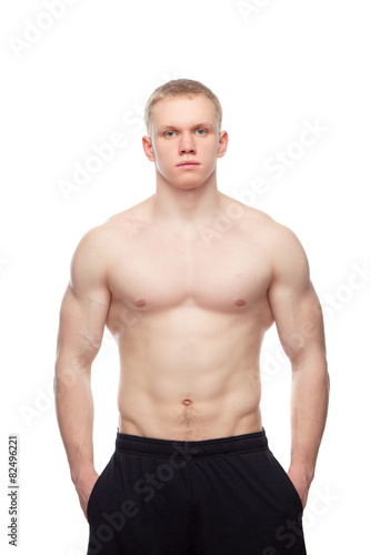 Image of muscle man posing in studio.