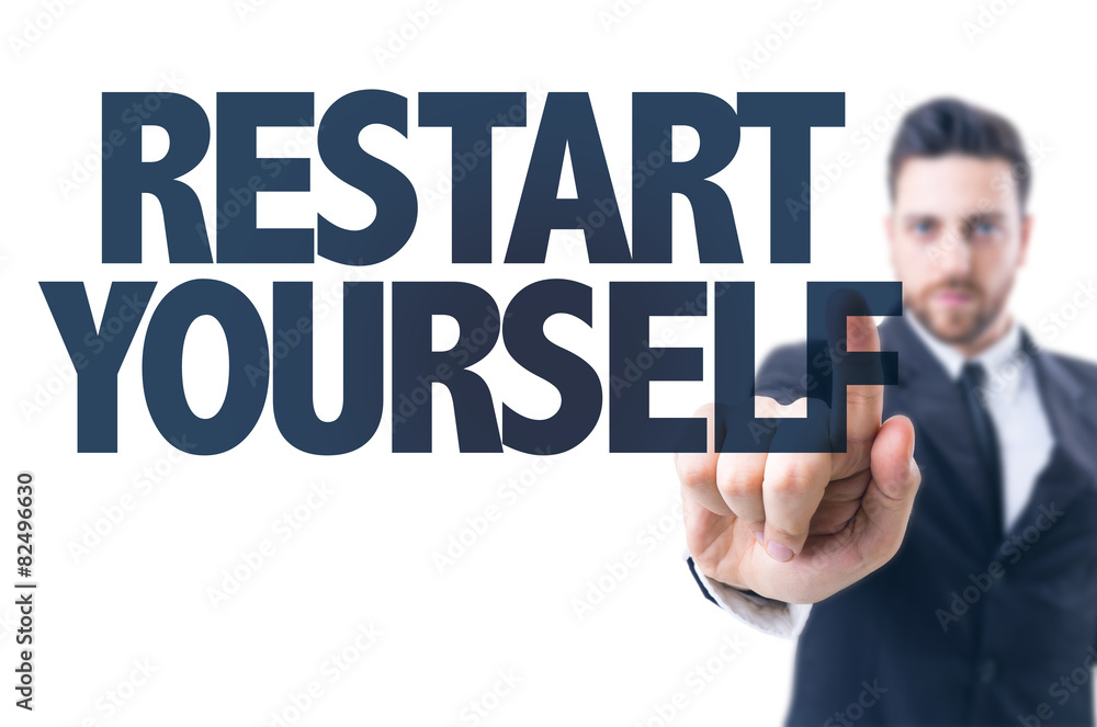 Business man pointing the text: Restart Yourself Business man pointing the text: Restart Yourself