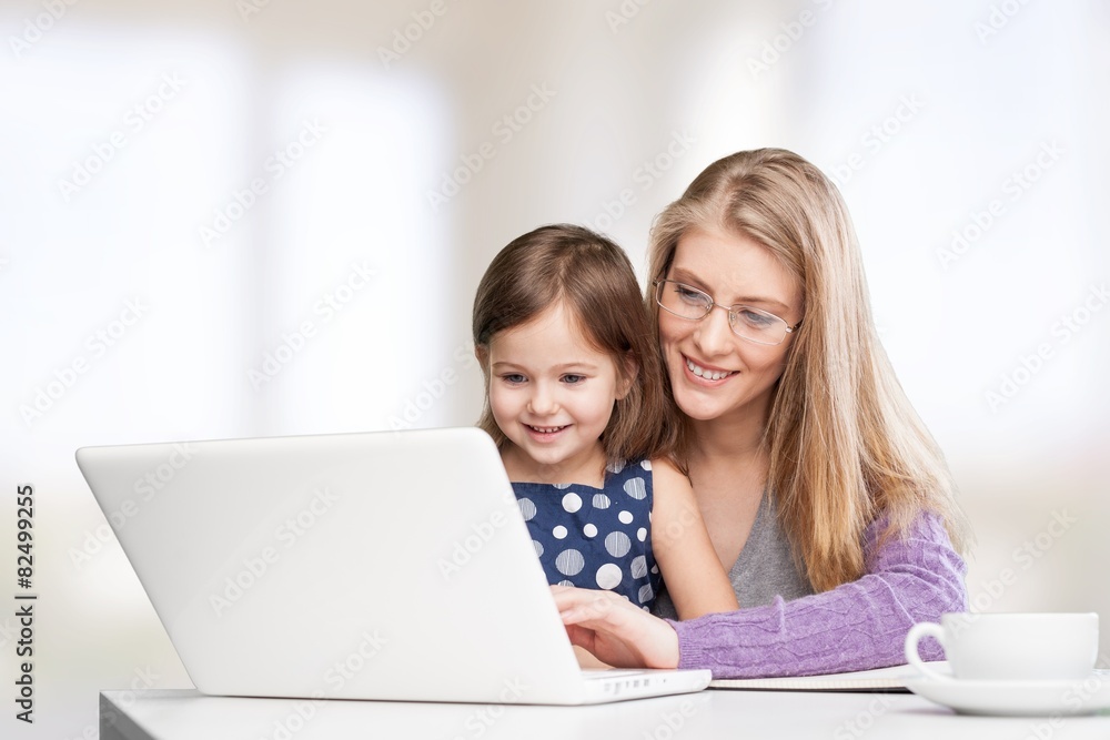 Busy. Busy Mother Working From Home With Daughter