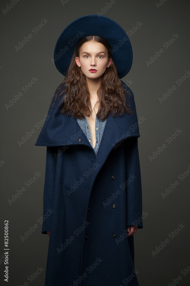 fashion model woman coat and hat urban style pose on color fashion model woman coat and hat urban style pose on color