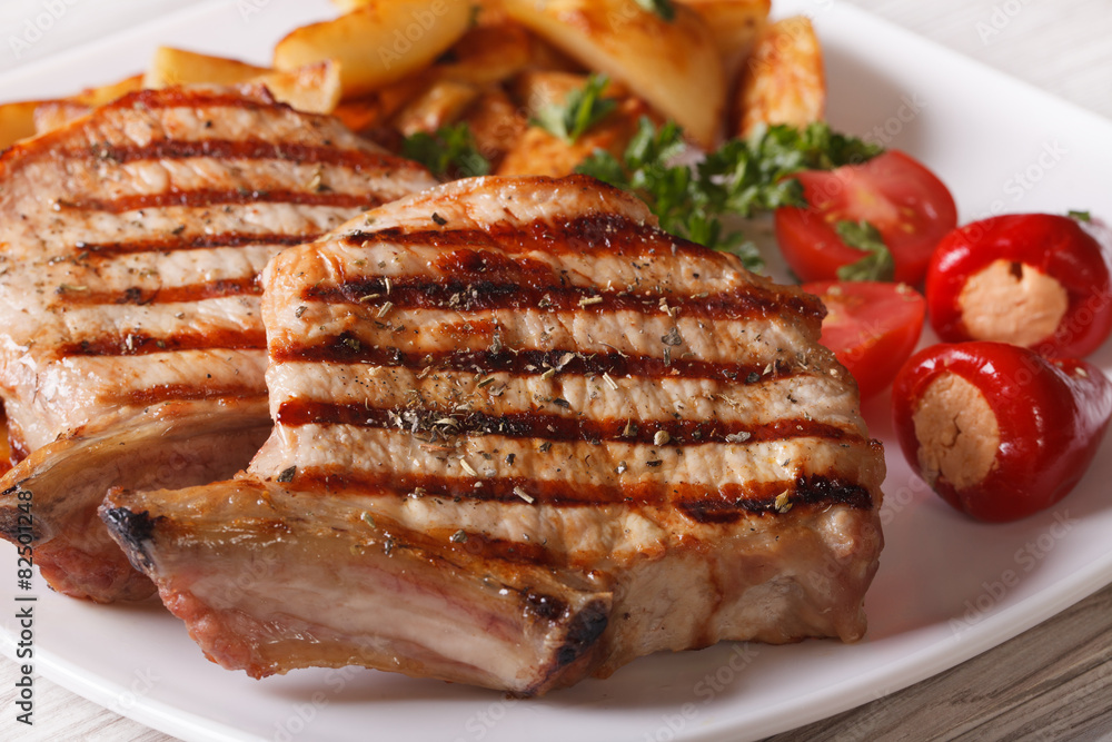 Grilled pork steak with potatoes on a plate, macro
Grilled pork steak with potatoes on a plate, macro