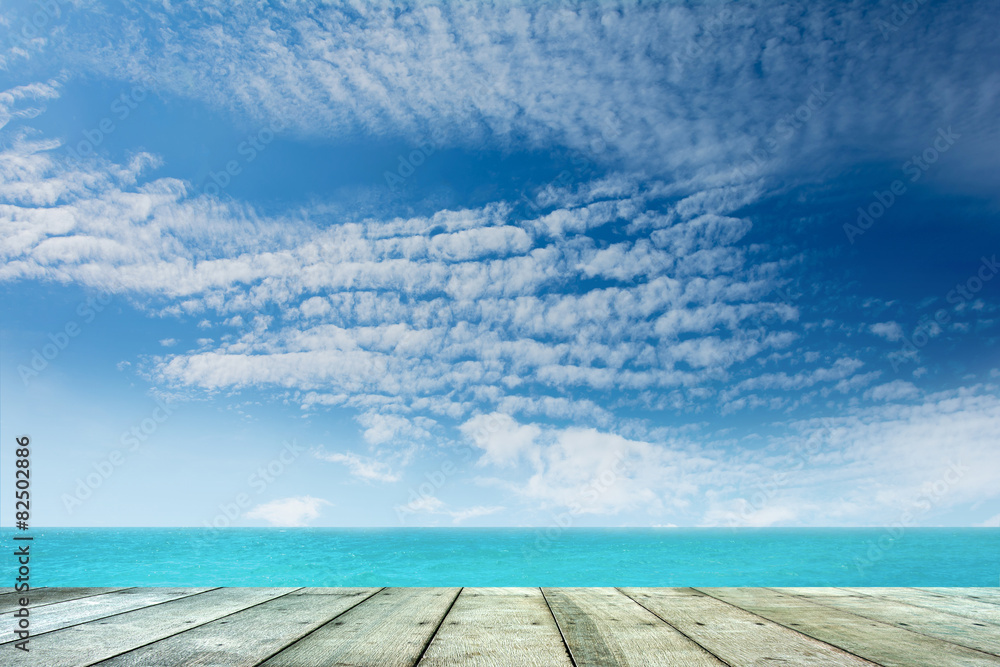 Wooden floor with sea background.