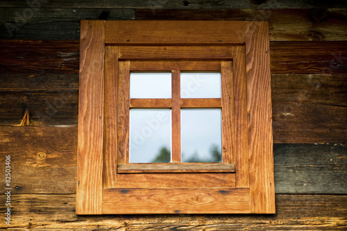 Wooden window at wooden wall