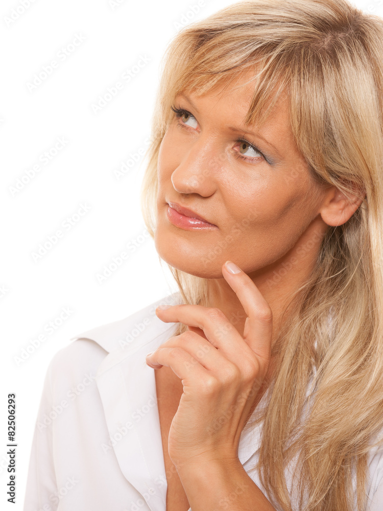 Thinking mature woman looking up isolated Thinking mature woman looking up isolated