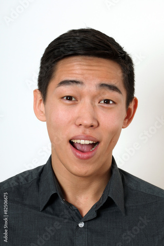 Laughing young Asian man looking at camera © Vladimir Wrangel
