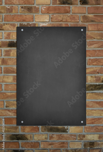 Blackboard on brick wall