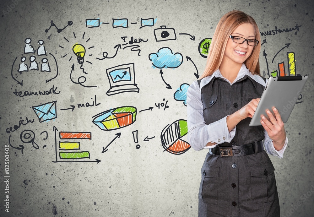 Tablet. Young beautiful female using tablet and smiling Tablet. Young beautiful female using tablet and smiling