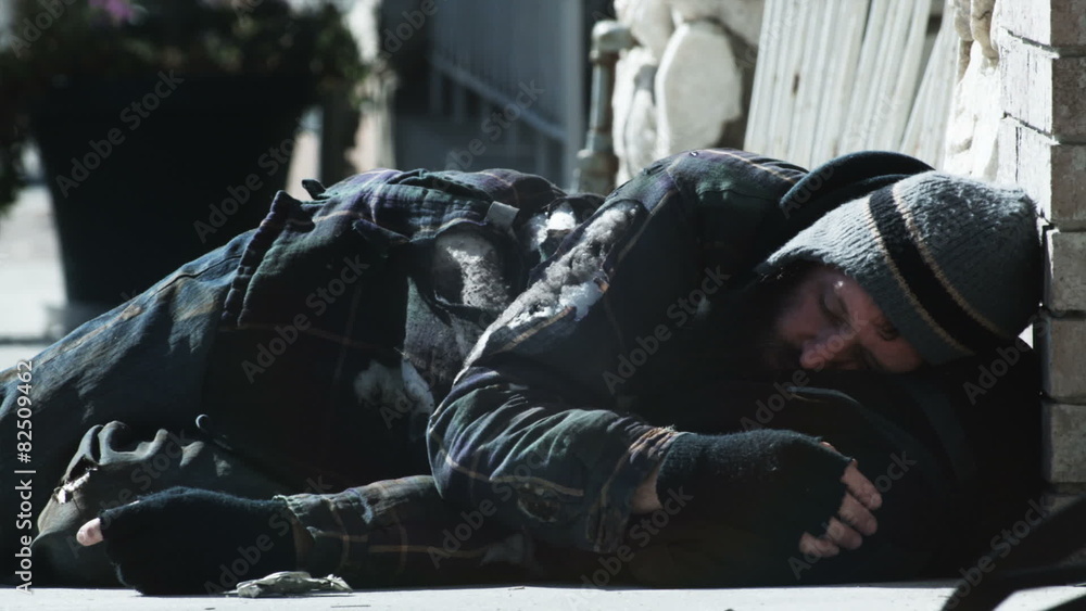 homeless man sleeping on the street homeless man sleeping on the street