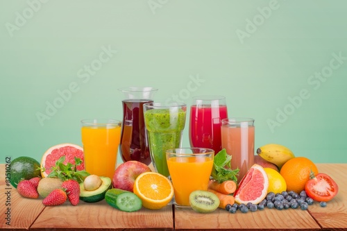 Fruit. Glasses of fruit and vegetable juice with fruits on a