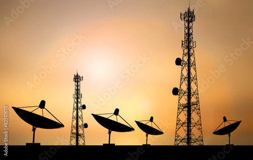 Satellite shadow and phone antenna orange sky background