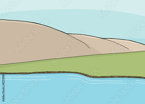 Empty Field and Mountains Along Lake