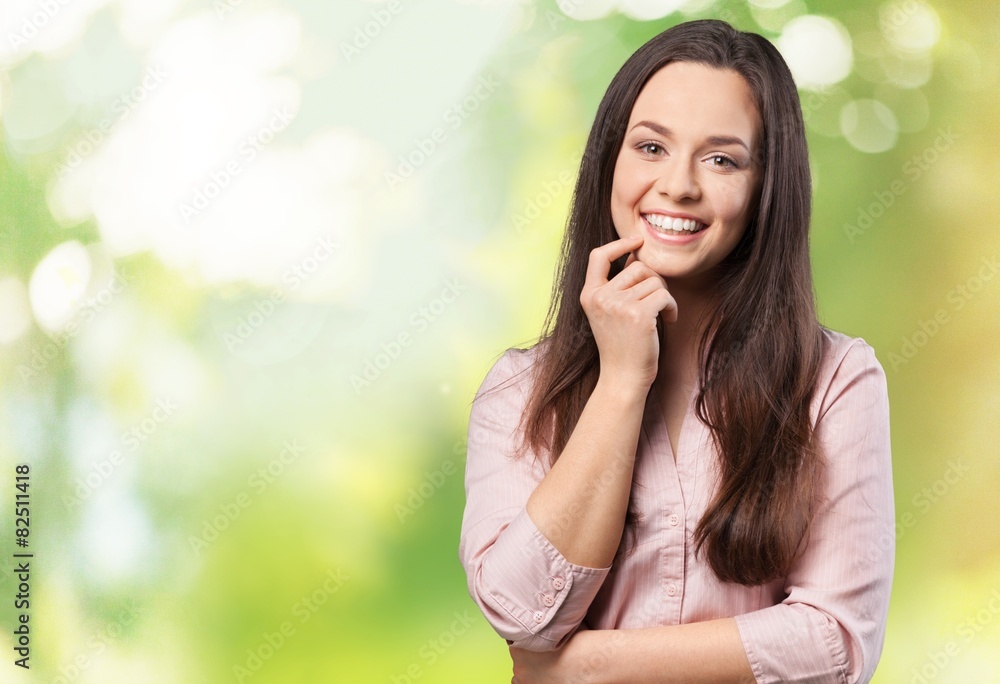 White. Thoughtful woman smiling - isolated over a white White. Thoughtful woman smiling - isolated over a white
