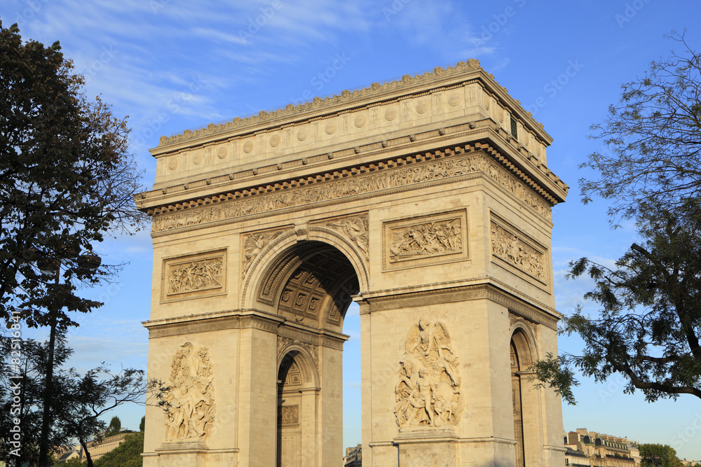 Arc de Triomphe paris france famous landmark monument side view blue sky background photo