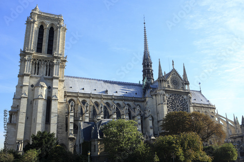 Notre Dame cathedral Paris France side view scene from River Seine with towers and rose window photo