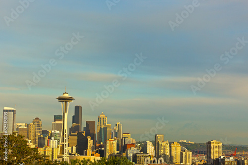 Illuminated Seattle buildings and Mt Rainier contour at sunset